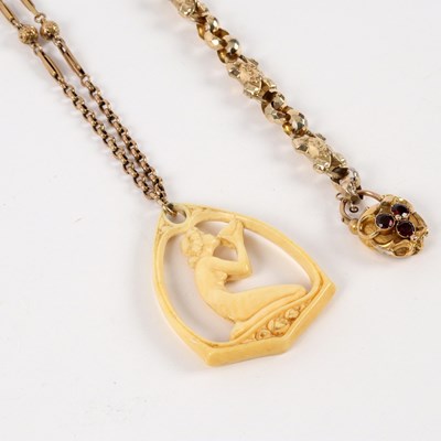 Lot 50 - An early 20th Century ivory pendant of stirrup...