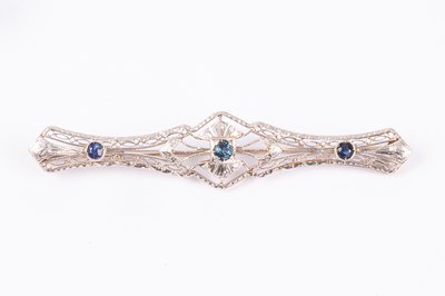 Lot 65 - An Edwardian style 14k yellow and white gold sapphire and zircon bar brooch