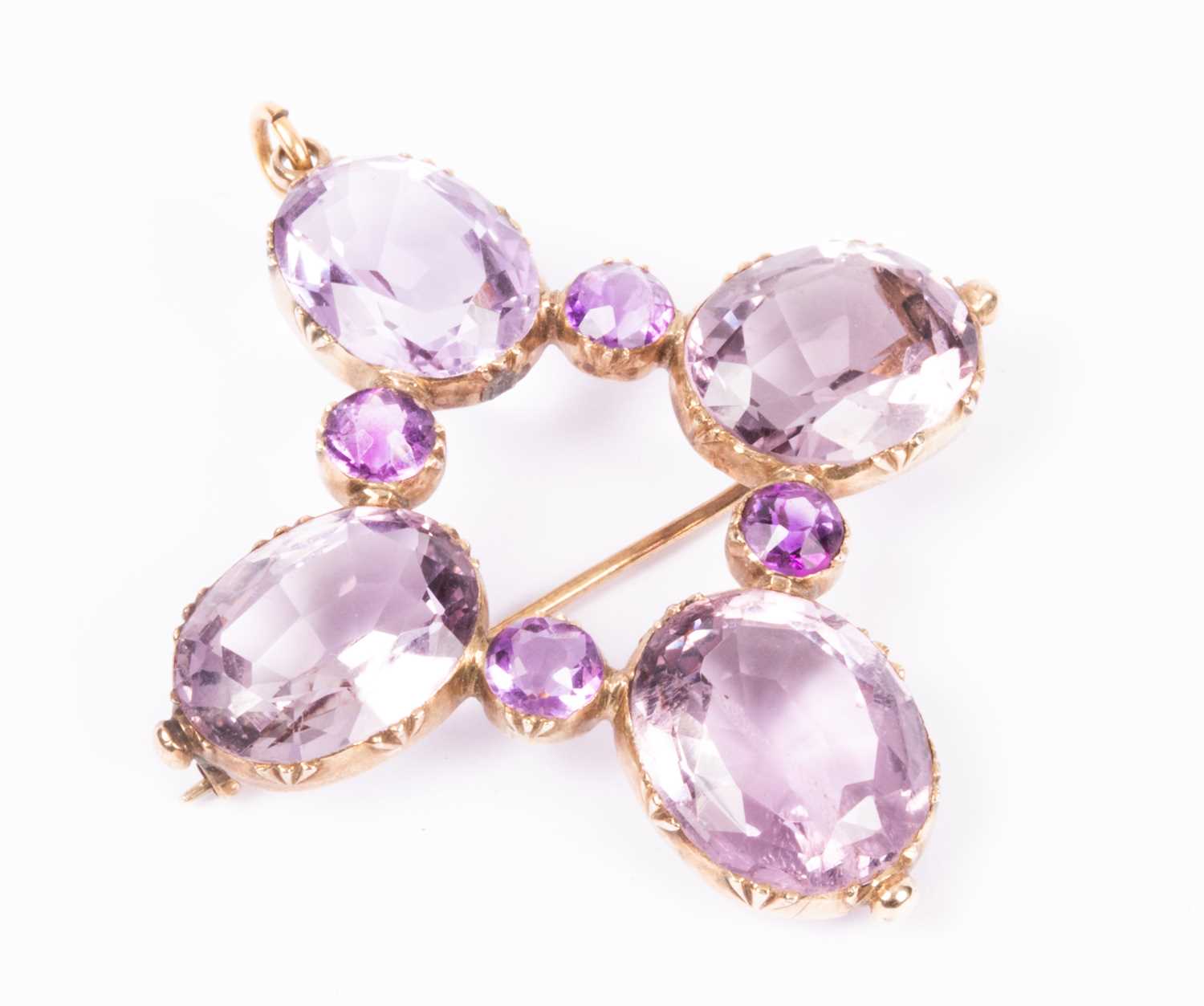 Lot 85 - A 19th Century yellow metal and amethyst brooch/pendant