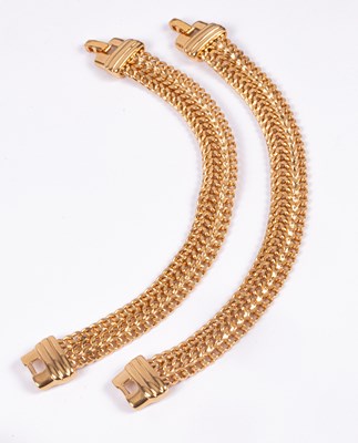 Lot 60 - A pair of Monet yellow metal bracelets