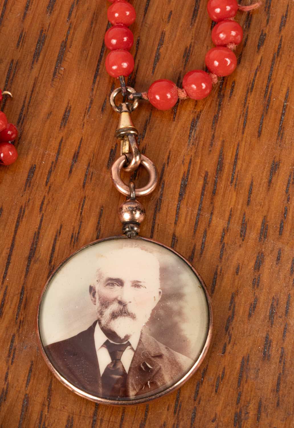 Lot 97 - A long coral guard chain