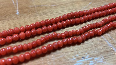 Lot 97 - A long coral guard chain