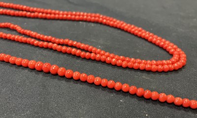 Lot 97 - A long coral guard chain