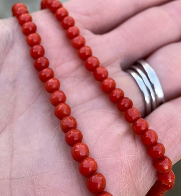 Lot 97 - A long coral guard chain