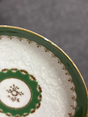 Lot 516 - A Worcester chrysanthemum-moulded teabowl and saucer