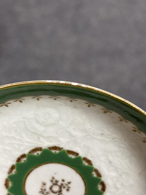 Lot 516 - A Worcester chrysanthemum-moulded teabowl and saucer