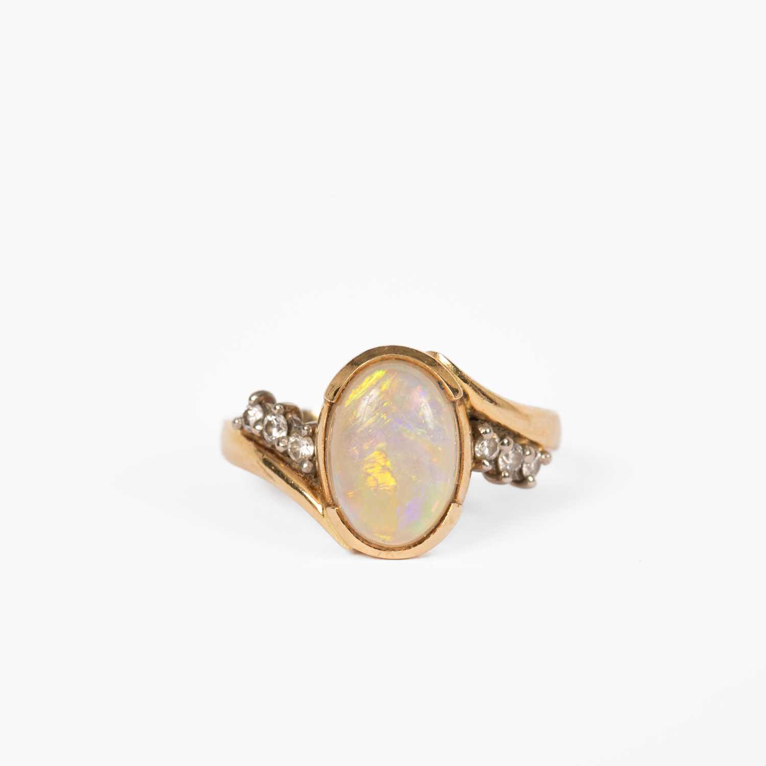 Lot 12 - An opal and diamond yellow metal dress ring
