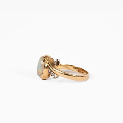 Lot 12 - An opal and diamond yellow metal dress ring