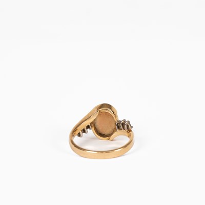 Lot 12 - An opal and diamond yellow metal dress ring