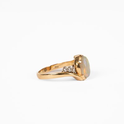 Lot 12 - An opal and diamond yellow metal dress ring