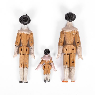 Lot 519 - Three German ‘alien head' dolls' house dolls