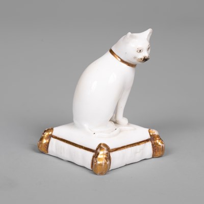 Lot 611 - A rare Rockingham porcelain miniature model of a cat