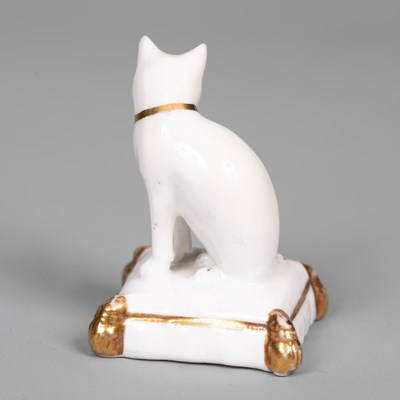 Lot 611 - A rare Rockingham porcelain miniature model of a cat