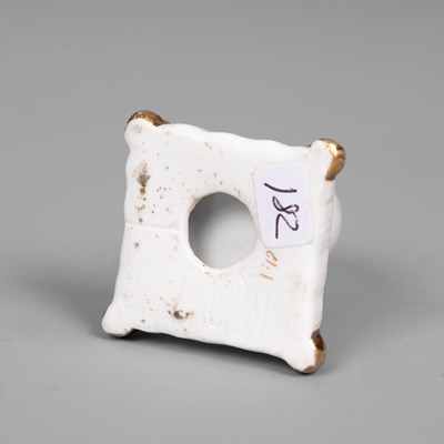 Lot 611 - A rare Rockingham porcelain miniature model of a cat