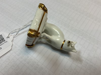 Lot 611 - A rare Rockingham porcelain miniature model of a cat