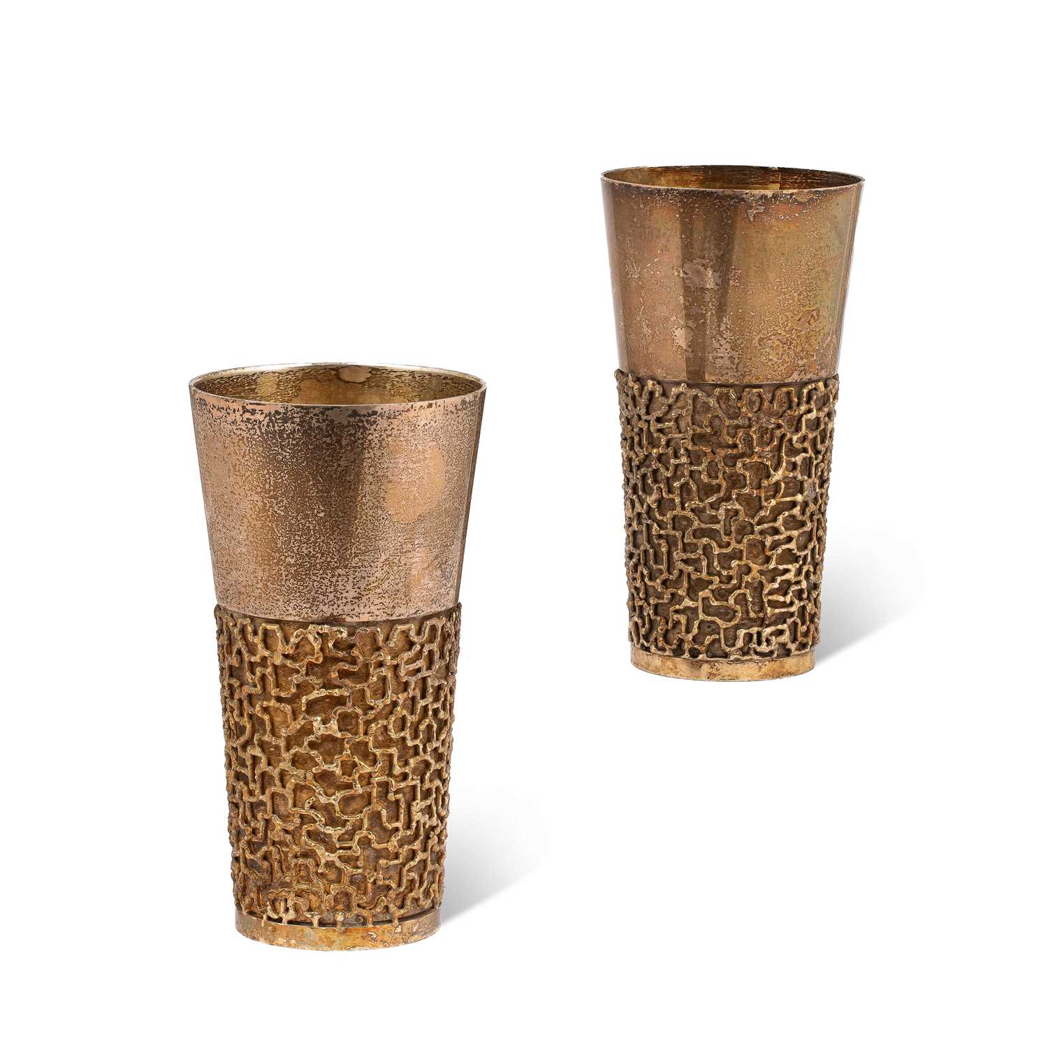 Lot 21 - Stuart Devlin (1931-2018) A pair of silver and silver-gilt beakers