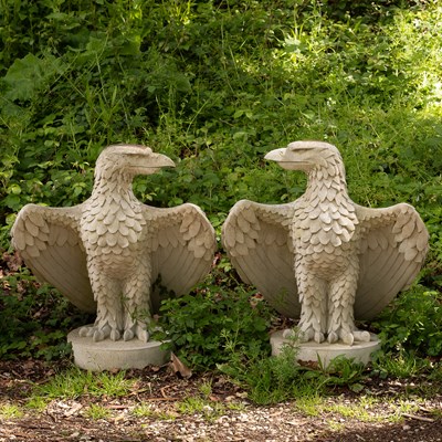 Lot 504 - A pair of composition stone eagles