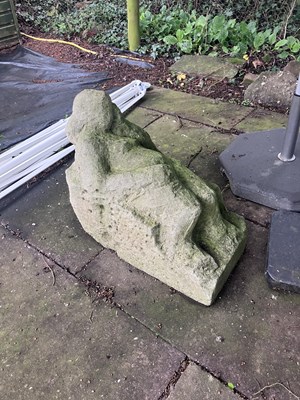 Lot 510 - A carved stone reclining figure