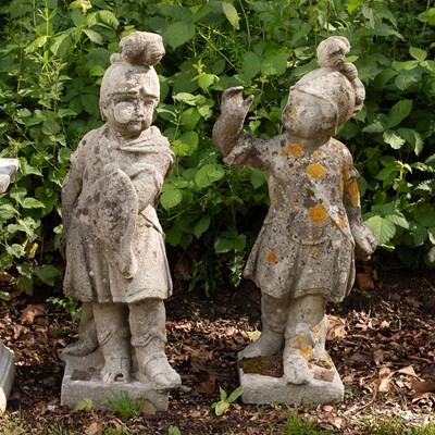 Lot 517 - A pair of composition stone figures