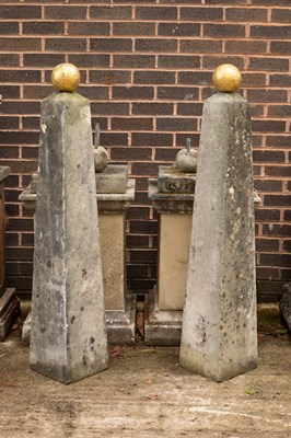 Lot 520 - A pair of composition stone obelisks