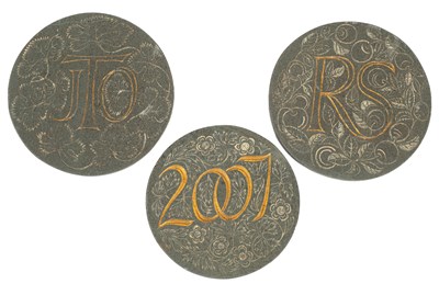 Lot 528 - A pair of circular slate wall plaques