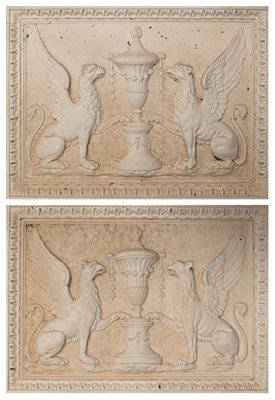 Lot 532 - A pair of Haddonstone Griffin wall plaques