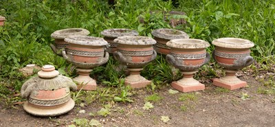 Lot 548 - A set of eight twin-handled urns