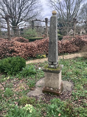 Lot 553 - A composition stone obelisk