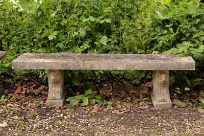 Lot 558 - A composition stone garden bench