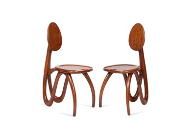 Lot 300 - A pair of mahogany chairs by Luca & Paolo Giacomuzzi