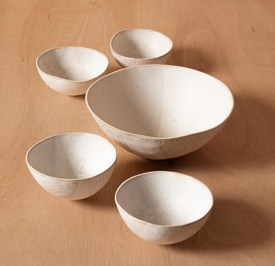 Lot 455 - A set of five white glazed bowls