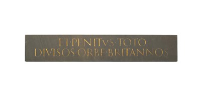 Lot 585 - A carved slate wall plaque