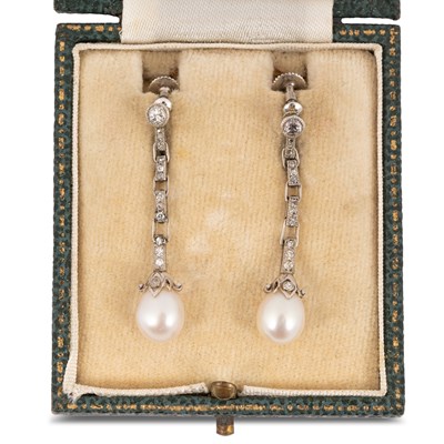 Lot A pair of early 20th Century pearl and diamond drop earrings
